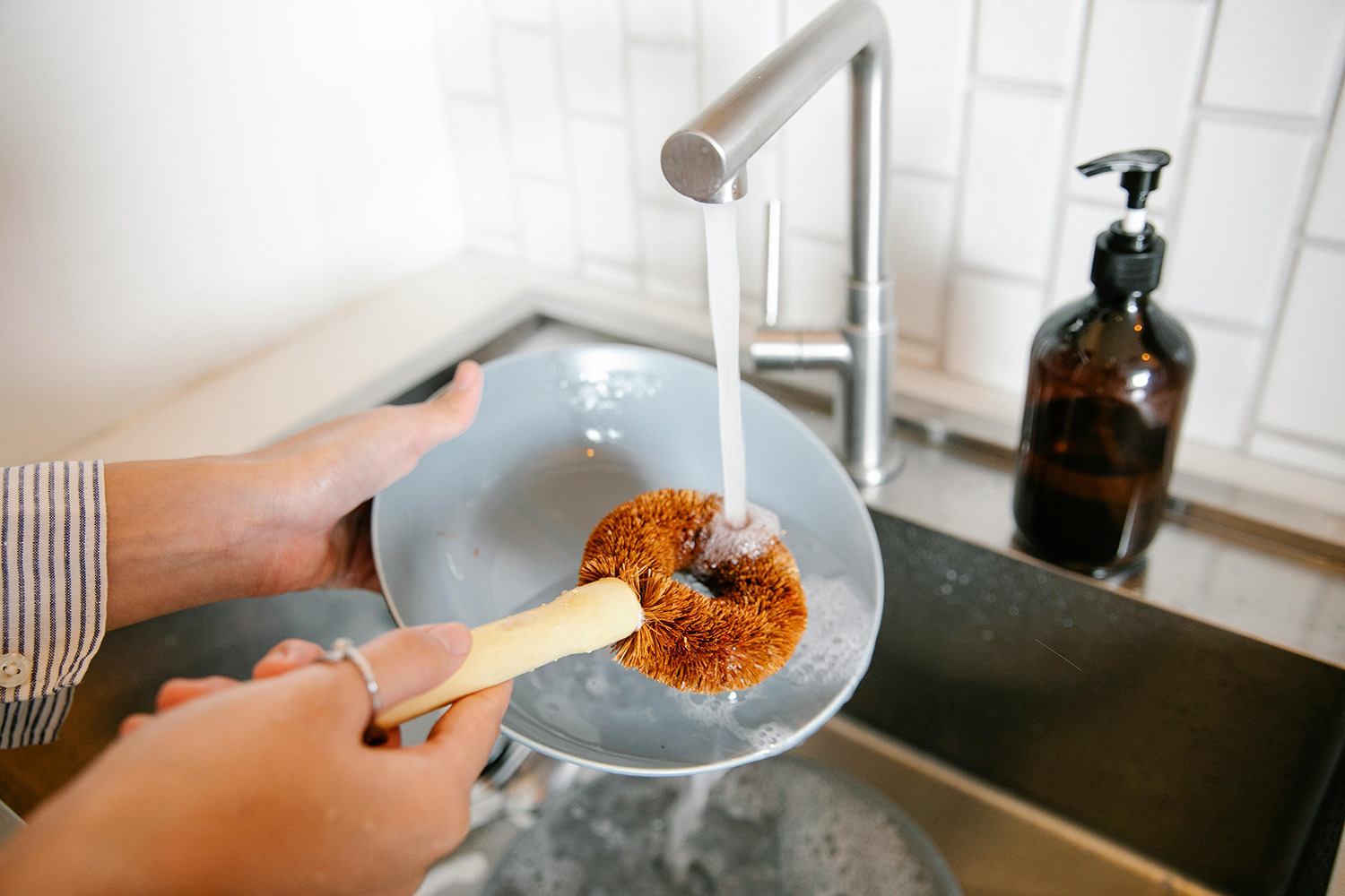 Kitchen sink with faucet on cleaning the dishes